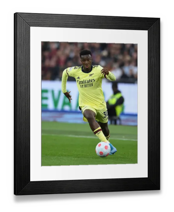 Framed Print : Arsenal's Eddie Nketiah Goes Head-to-Head with West Ham in Premier League Clash