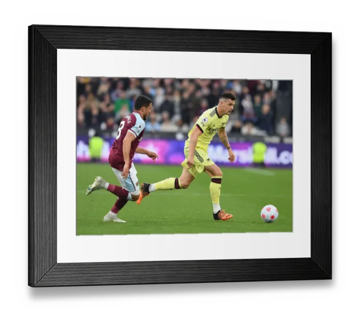 Framed Print : Xhaka vs Fornals: Intense Battle in West Ham United vs Arsenal Premier League Clash