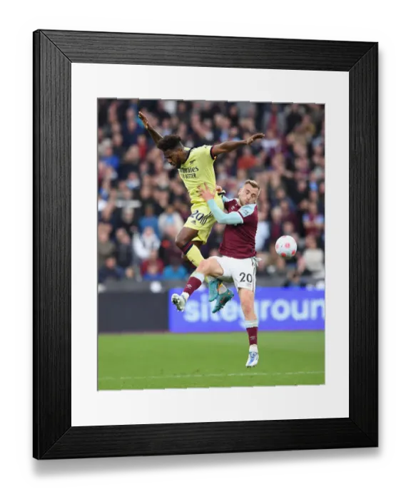 Framed Print : Clash of Titans: Nuno Tavares vs Jarrod Bowen - West Ham United vs Arsenal, Premier League 2021-22