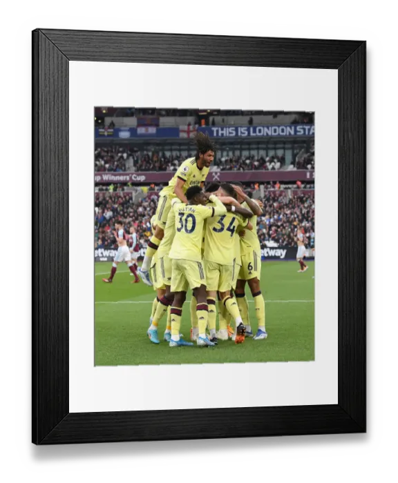 Framed Print : Arsenal's Holding Scores Dramatic Late Goal Against West Ham in Premier League Showdown