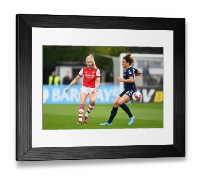 Framed Print : Arsenal's Leah Williamson in Action: Passing the Ball during FA WSL Match