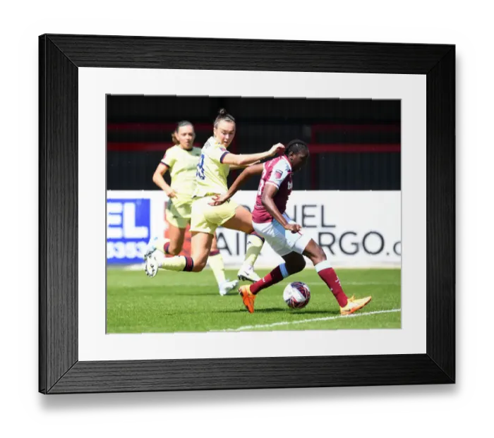 Framed Print : Clash of Titans: Caitlin Foord vs. Hawa Cissoko - Intense Battle: West Ham Women vs. Arsenal Women, FA WSL Showdown