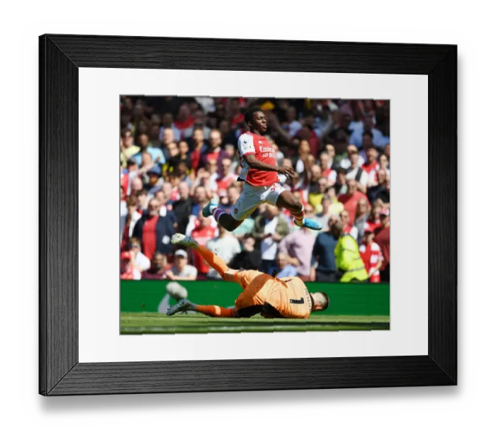 Framed Print : Arsenal's Eddie Nketiah Leaps Over Meslier in Thrilling Arsenal v Leeds United Clash, Premier League 2021-22
