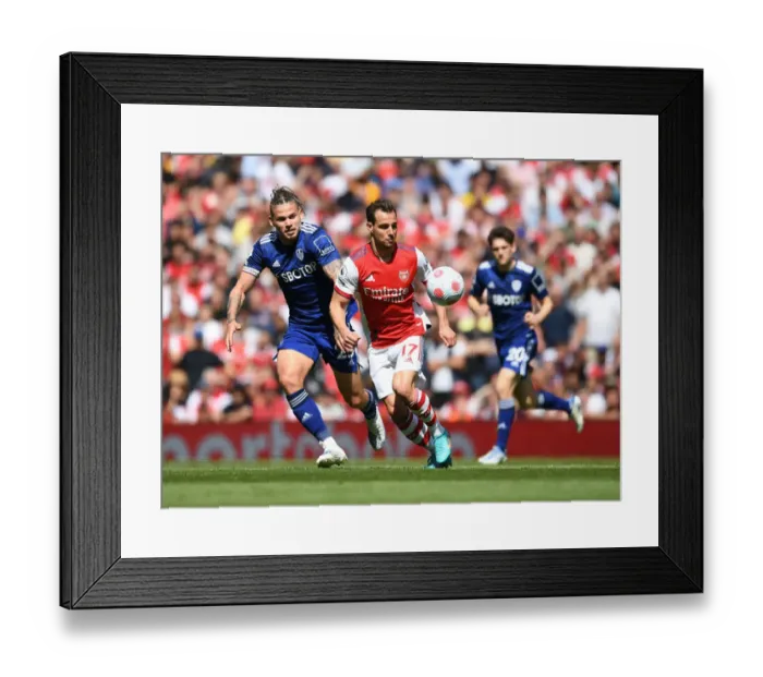 Framed Print : Arsenal vs Leeds United: Cedric Surges Past Phillips in Intense Premier League Clash