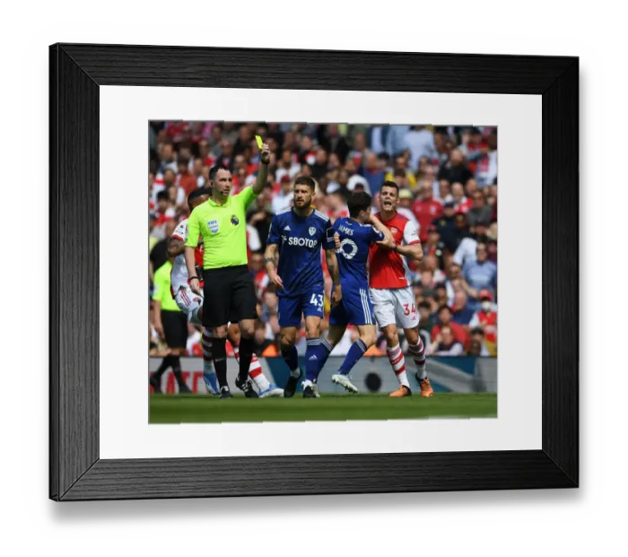 Framed Print : Clash of Titans: Xhaka vs. Mateusz in Arsenal's Battle Against Leeds United (Arsenal v Leeds United 2021-22)