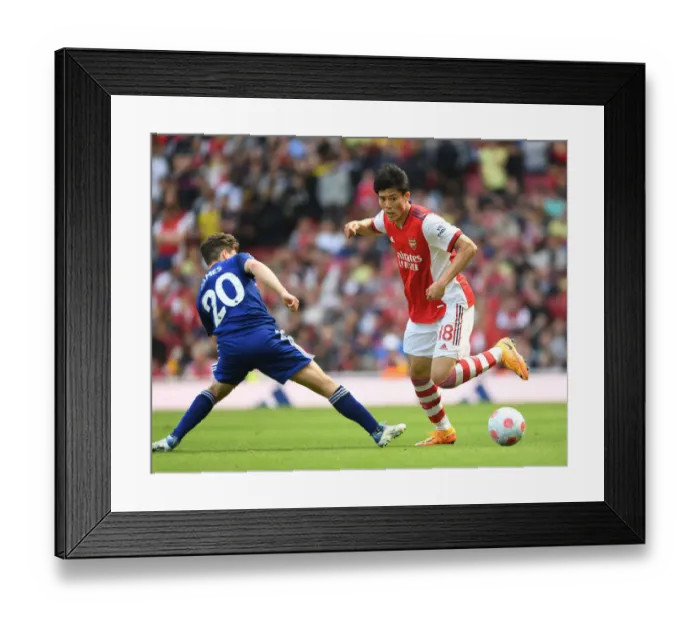 Framed Print : Arsenal vs Leeds United: Tomiyasu vs James Clash in Premier League Showdown