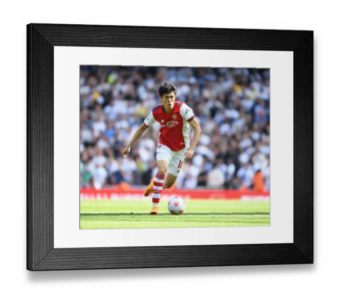 Framed Print : Arsenal's Tomiyasu in Action: Arsenal vs. Leeds United, Premier League 2021-22