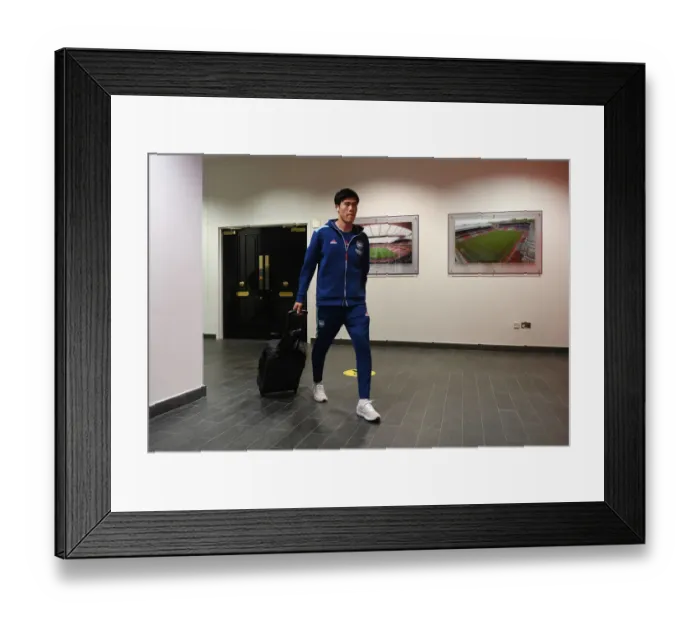 Framed Print : Arsenal's Tomiyasu Gears Up: Arsenal vs Leeds United, Premier League 2021-22