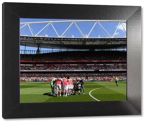 Arsenal vs Leeds United: Premier League Showdown - Arsenal Team Huddle at Emirates Stadium