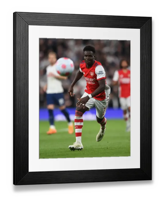 Framed Print : Showdown at the Stadium: Bukayo Saka Faces Tottenham in Premier League Clash