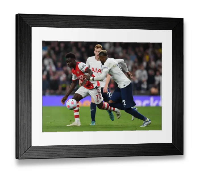 Framed Print : Bukayo Saka Faces Off Against Emerson Royal and Kulusevski in Intense Tottenham-Arsenal Clash (Premier League 2021-22)