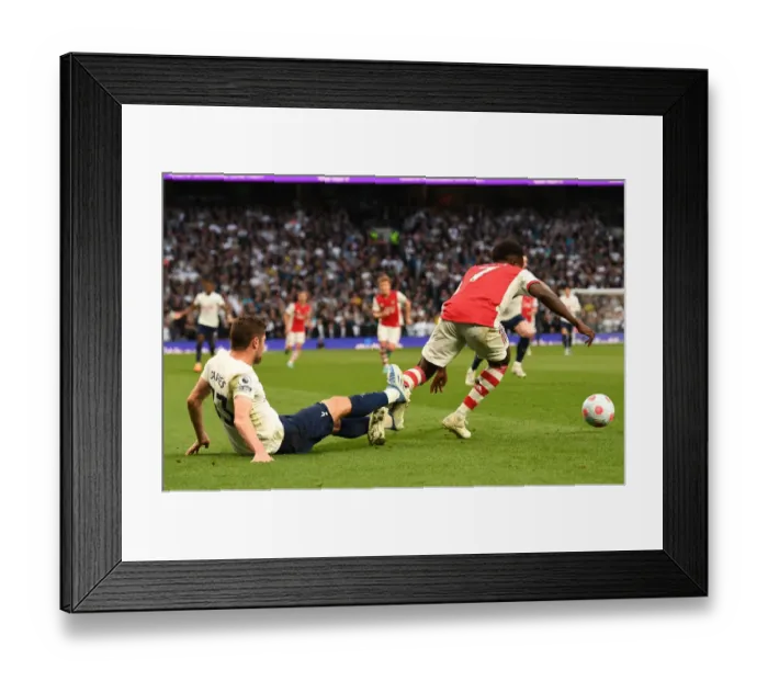 Framed Print : Tottenham vs Arsenal: Bukayo Saka Fouled by Ben Davies in Intense Premier League Clash (2021-22) Framed Print : Tottenham vs Arsenal: Bukayo Saka Fouled by Ben Davies in Intense Premier League Clash (2021-22)