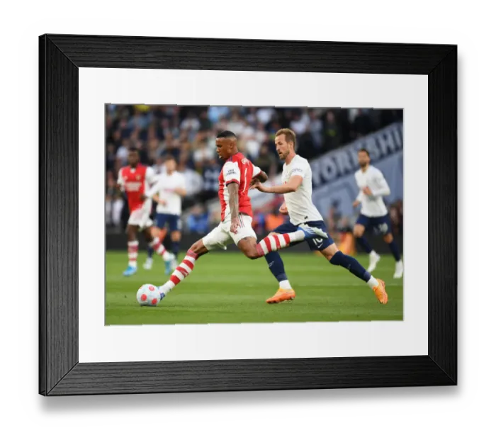 Framed Print : Gabriel Outmuscles Harry Kane: Intense Battle Between Tottenham and Arsenal in Premier League Showdown (2021-22)