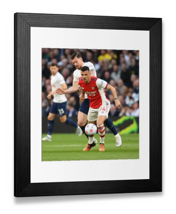 Framed Print : Xhaka vs. Hojbjerg: Intense Rivalry in the Premier League Clash Between Tottenham and Arsenal