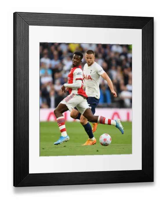 Framed Print : Arsenal's Eddie Nketiah Faces Off Against Tottenham's Eric Dier in Intense Premier League Clash