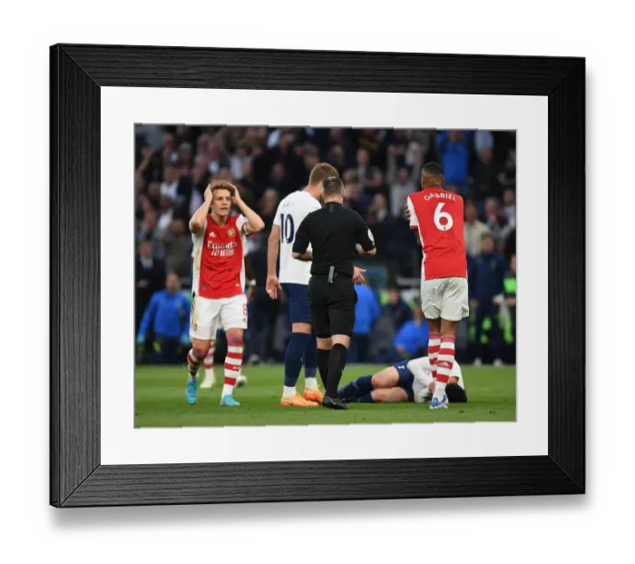 Framed Print : Martin Odegaard Contests Referee Decision in Intense Tottenham vs. Arsenal Clash (Premier League 2021-22)