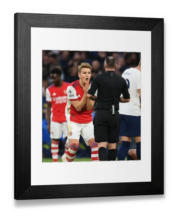 Framed Print : Martin Odegaard Appeals to Referee during Intense Tottenham vs. Arsenal Premier League Clash