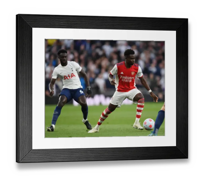 Framed Print : Bukayo Saka Dashes Past Sanchez: Tottenham vs. Arsenal, Premier League 2021-22 Framed Print : Bukayo Saka Dashes Past Sanchez: Tottenham vs. Arsenal, Premier League 2021-22