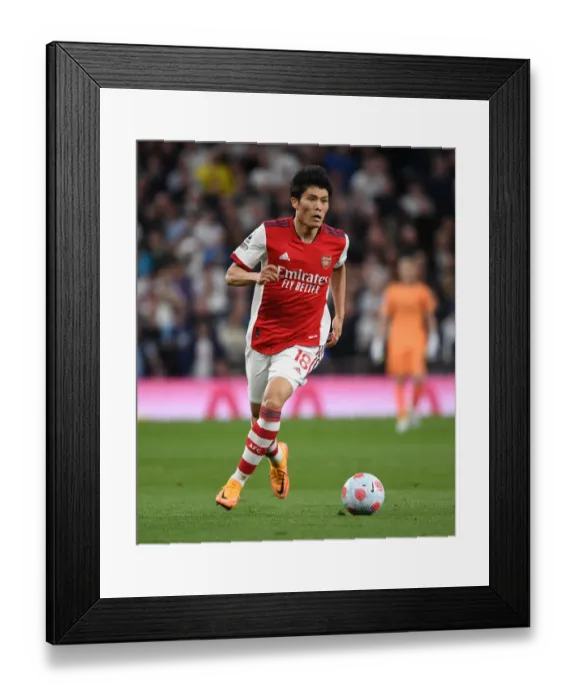Framed Print : Tomiyasu vs. Tottenham: Intense Rivalry Clash - Arsenal's Star Defender Faces Off in Premier League Showdown