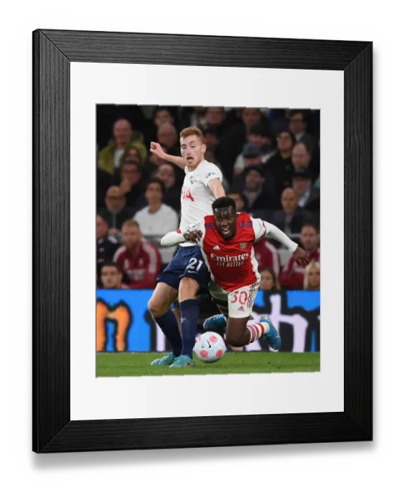 Framed Print : Arsenal vs. Tottenham: Nketiah Fouls Kulusevski in Intense Premier League Clash (2021-22)
