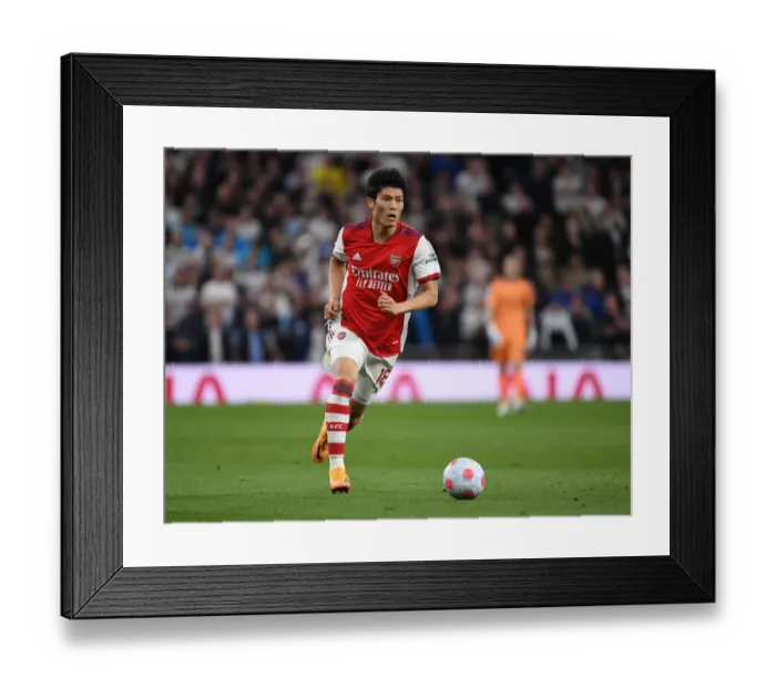 Framed Print : Arsenal's Tomiyasu Faces Off Against Tottenham in Premier League Clash Framed Print : Arsenal's Tomiyasu Faces Off Against Tottenham in Premier League Clash