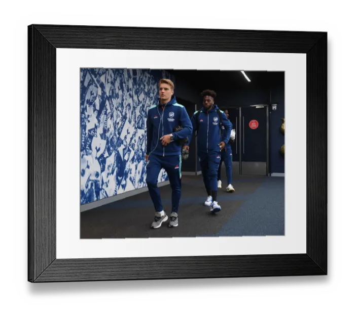 Framed Print : Arsenal's Martin Odegaard and Nuno Tavares Face Off Against Tottenham Hotspur in Premier League Clash