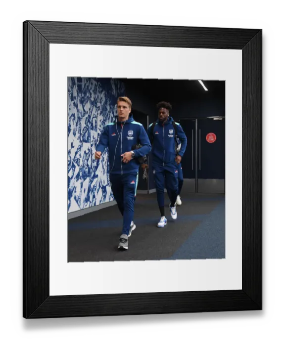 Framed Print : Martin Odegaard and Nuno Tavares Go Head-to-Head in Intense Arsenal vs. Tottenham Showdown