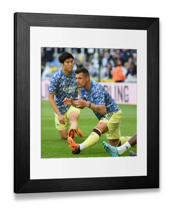 Framed Print : Granit Xhaka's Pre-Match Routine: Arsenal vs. Newcastle United, Premier League 2021-22
