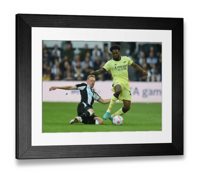 Framed Print : Arsenal's Nuno Tavares Faces Off Against Newcastle's Sean Longstaff in Intense Premier League Clash Framed Print : Arsenal's Nuno Tavares Faces Off Against Newcastle's Sean Longstaff in Intense Premier League Clash