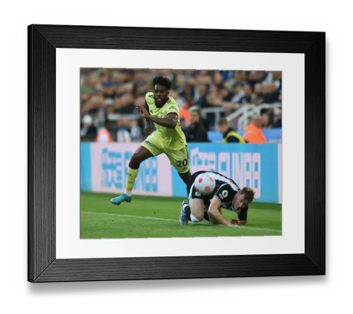 Framed Print : Nuno Tavares vs Emil Krafth: Battle at St. James Park - Newcastle United vs Arsenal, Premier League 2021-22