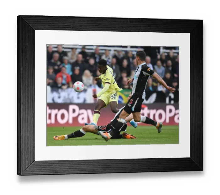 Framed Print : Arsenal's Eddie Nketiah in Action Against Newcastle United - Premier League Showdown (2021-22)