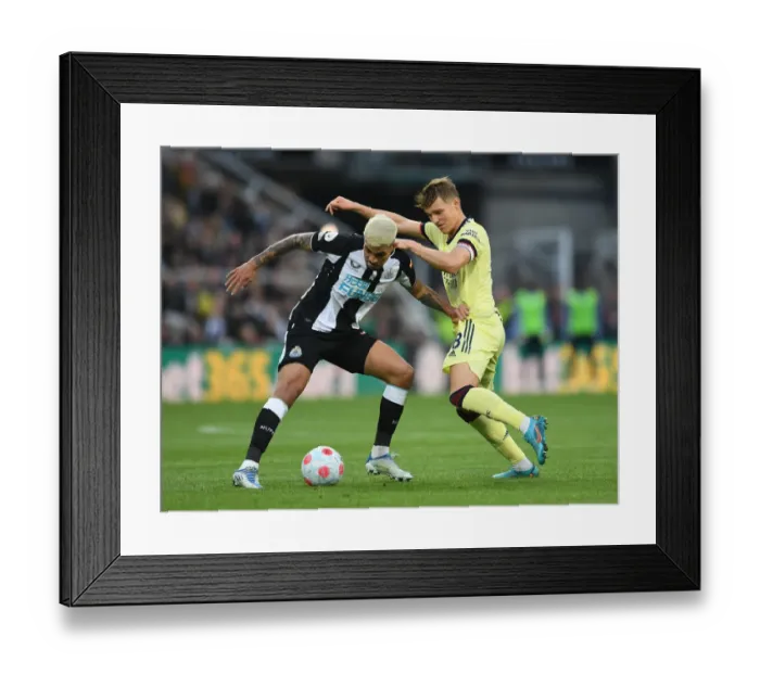 Framed Print : Clash at St. James Park: Martin Odegaard vs Bruno Guimaraes in Newcastle United vs Arsenal Premier League Encounter