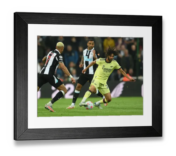 Framed Print : Elneny vs Wilson: Intense Battle in Newcastle United vs Arsenal Premier League Clash