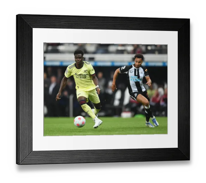 Framed Print : Bukayo Saka vs Jacob Murphy: Intense Battle at St. James Park - Arsenal vs Newcastle United, Premier League 2021-22