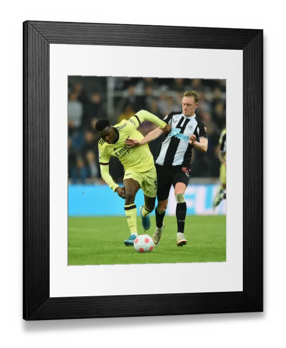 Framed Print : Newcastle United vs. Arsenal: Intense Battle Between Eddie Nketiah and Sean Longstaff in Premier League Clash Framed Print : Newcastle United vs. Arsenal: Intense Battle Between Eddie Nketiah and Sean Longstaff in Premier League Clash