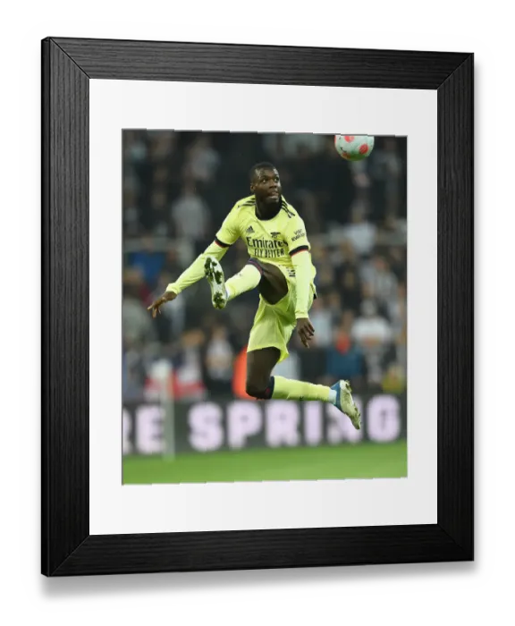 Framed Print : Arsenal's Pepe Shines: Newcastle United vs. Arsenal, Premier League 2021-22