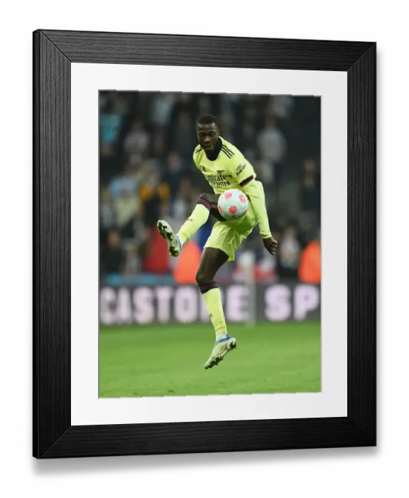 Framed Print : Pepe in Action: Arsenal's Standout Performance vs. Newcastle United, Premier League 2021-22