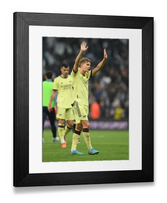 Framed Print : Martin Odegaard's Heartbreaking Reaction: Arsenal's Devastating Defeat at Newcastle, Premier League 2021-22