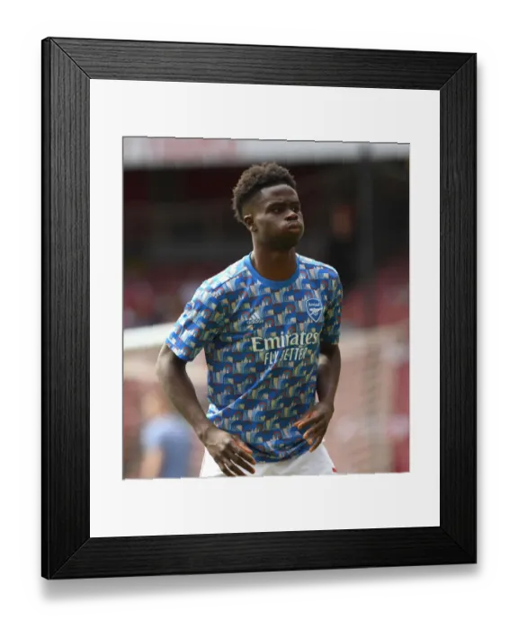 Framed Print : Arsenal's Bukayo Saka Gears Up: Arsenal v Everton, Premier League 2021-22