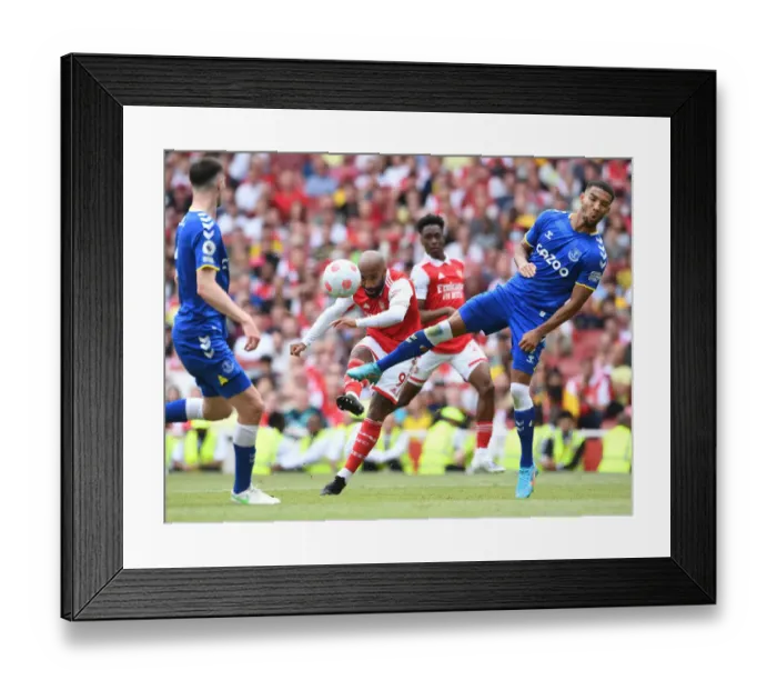 Framed Print : Arsenal's Lacazette Faces Off Against Everton's Holgate in Intense Premier League Showdown Framed Print : Arsenal's Lacazette Faces Off Against Everton's Holgate in Intense Premier League Showdown