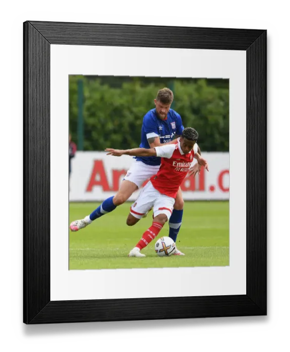 Framed Print : Arsenal's Omari Hutchinson: A Shining Star in Pre-Season Victory over Ipswich Town