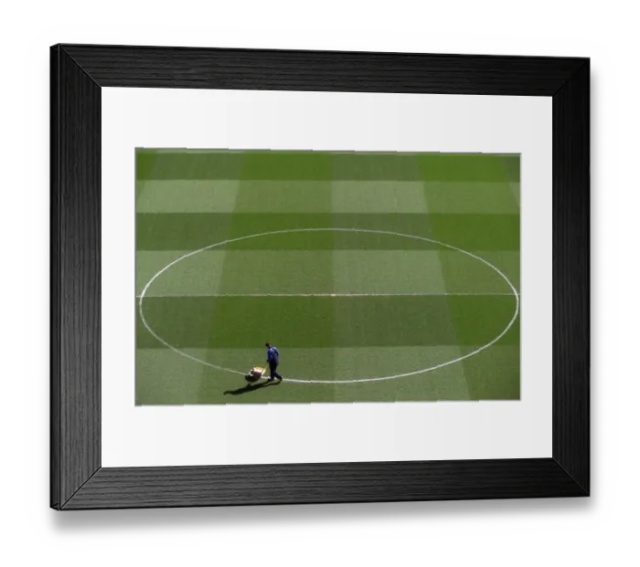 Framed Print : Groundsman Paul Burgess marks out the pitch before the match