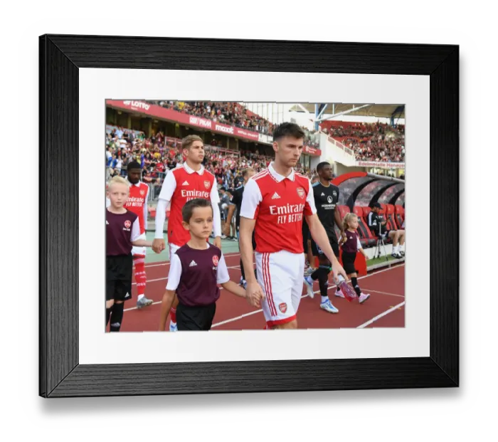 Framed Print : Arsenal's Kieran Tierney Meets Nurnberg Mascot Ahead of 2022 Pre-Season Clash Framed Print : Arsenal's Kieran Tierney Meets Nurnberg Mascot Ahead of 2022 Pre-Season Clash