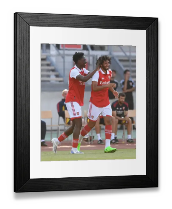 Framed Print : Arsenal's Mohamed Elneny and Albert Sambi Lokonga Celebrate Goal Against 1. FC Nurnberg in Pre-Season Friendly Framed Print : Arsenal's Mohamed Elneny and Albert Sambi Lokonga Celebrate Goal Against 1. FC Nurnberg in Pre-Season Friendly