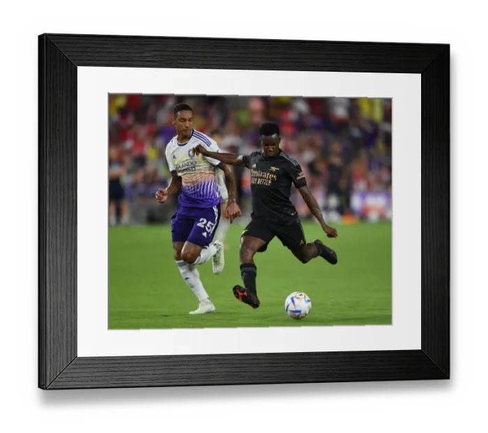 Framed Print : Arsenal's Eddie Nketiah Faces Off Against Orlando City's Antonio Carlos in Pre-Season Showdown Framed Print : Arsenal's Eddie Nketiah Faces Off Against Orlando City's Antonio Carlos in Pre-Season Showdown
