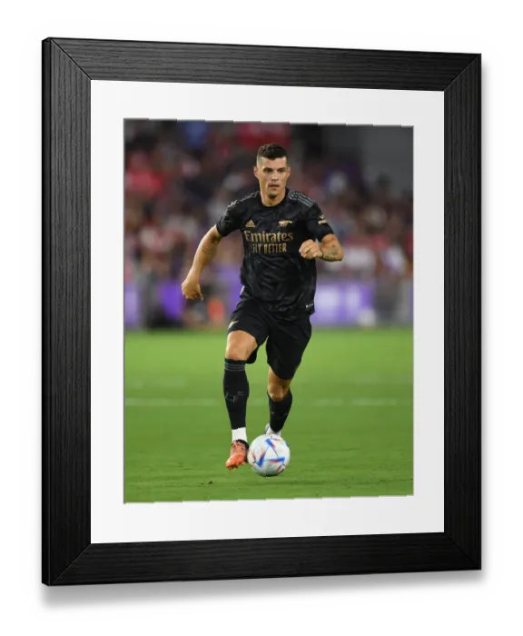 Framed Print : Granit Xhaka: Arsenal's Midfield Maestro Dazzles in Pre-Season Win Against Orlando City SC (2022-23) Framed Print : Granit Xhaka: Arsenal's Midfield Maestro Dazzles in Pre-Season Win Against Orlando City SC (2022-23)