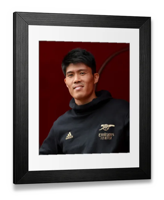 Framed Print : Arsenal's Tomiyasu Readies for Battle: Arsenal vs Sevilla - Emirates Cup 2022