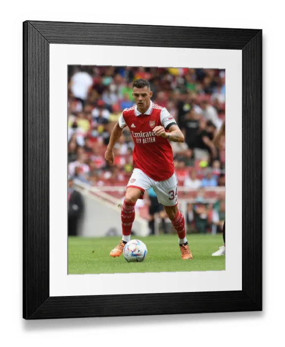 Framed Print : Granit Xhaka: In Action for Arsenal against Sevilla at Emirates Cup 2022 Framed Print : Granit Xhaka: In Action for Arsenal against Sevilla at Emirates Cup 2022