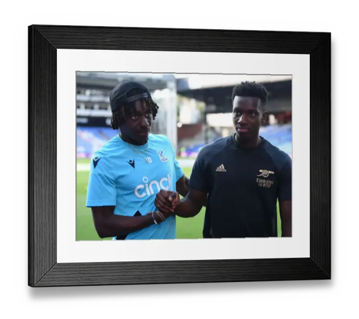 Framed Print : Crystal Palace vs. Arsenal: Nketiah and Eze Share a Moment in the 2022-23 Premier League Clash