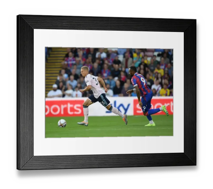 Framed Print : Arsenal's Zinchenko Outmaneuvers Crystal Palace's Ayew in Premier League Clash